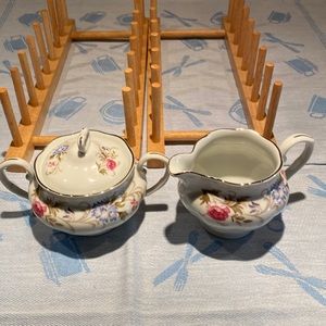 Sugar bowl and lid and creamer in white China with blue bachelors buttons